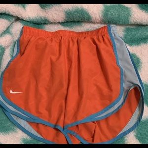 Orange nike shorts